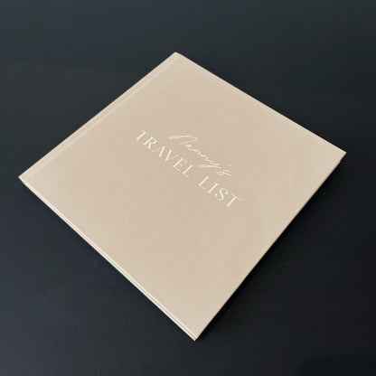 beige book with Nanny's Travel list on the cover